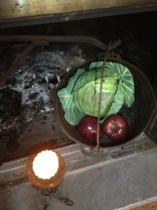 Apples and Cabbage in a cast iron pot over a fire